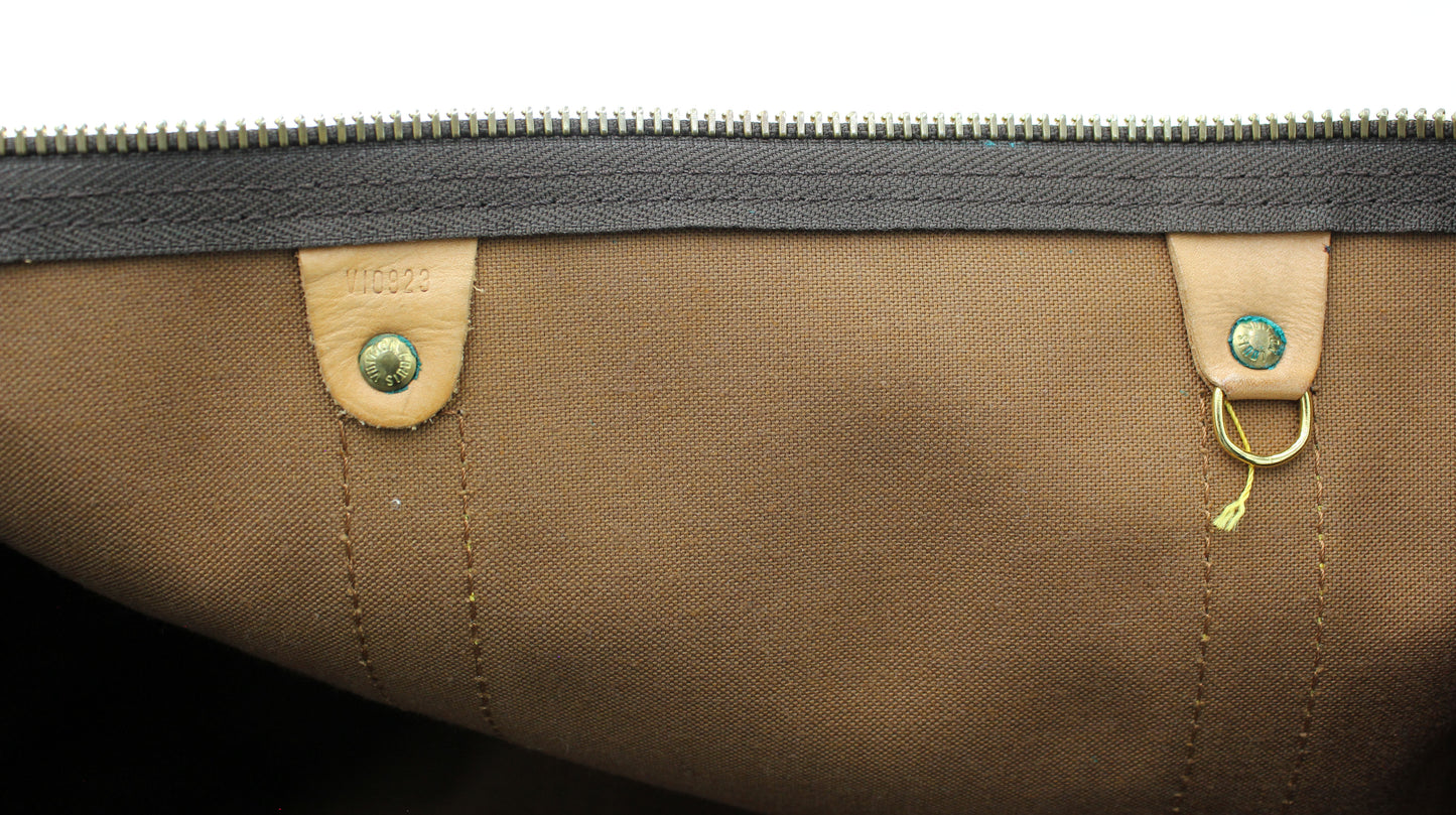 Louis Vuitton Keepall 55 (Duffle) with luggage tag