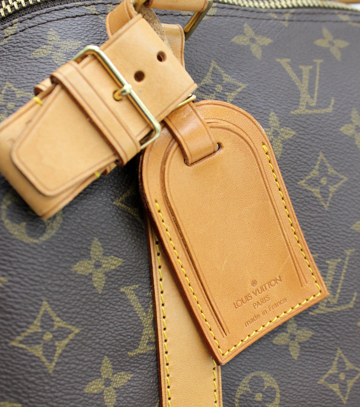 Louis Vuitton Keepall 55 (Duffle) with luggage tag
